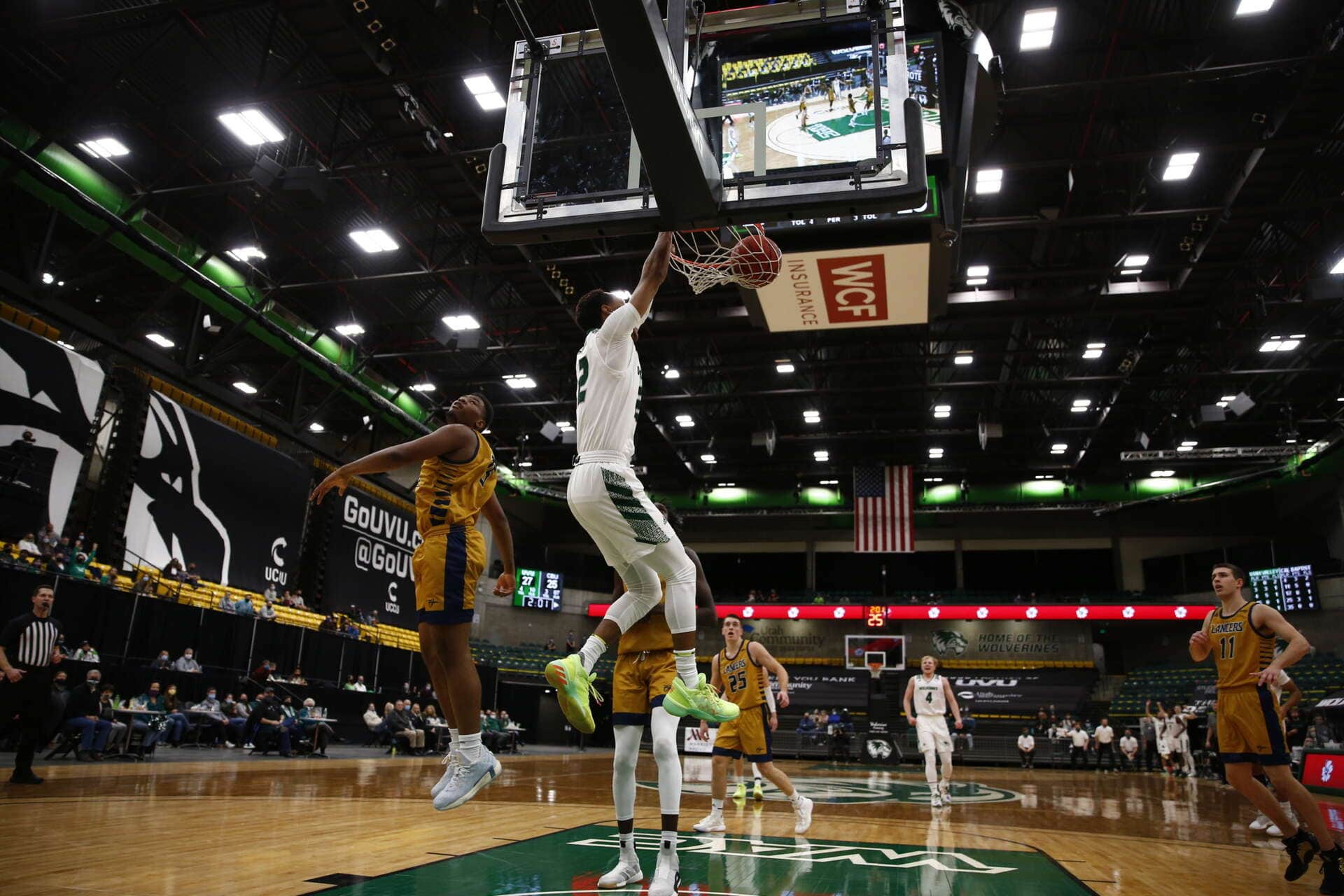 UVU basketball game featuring players in action at the American Fork Event Center.