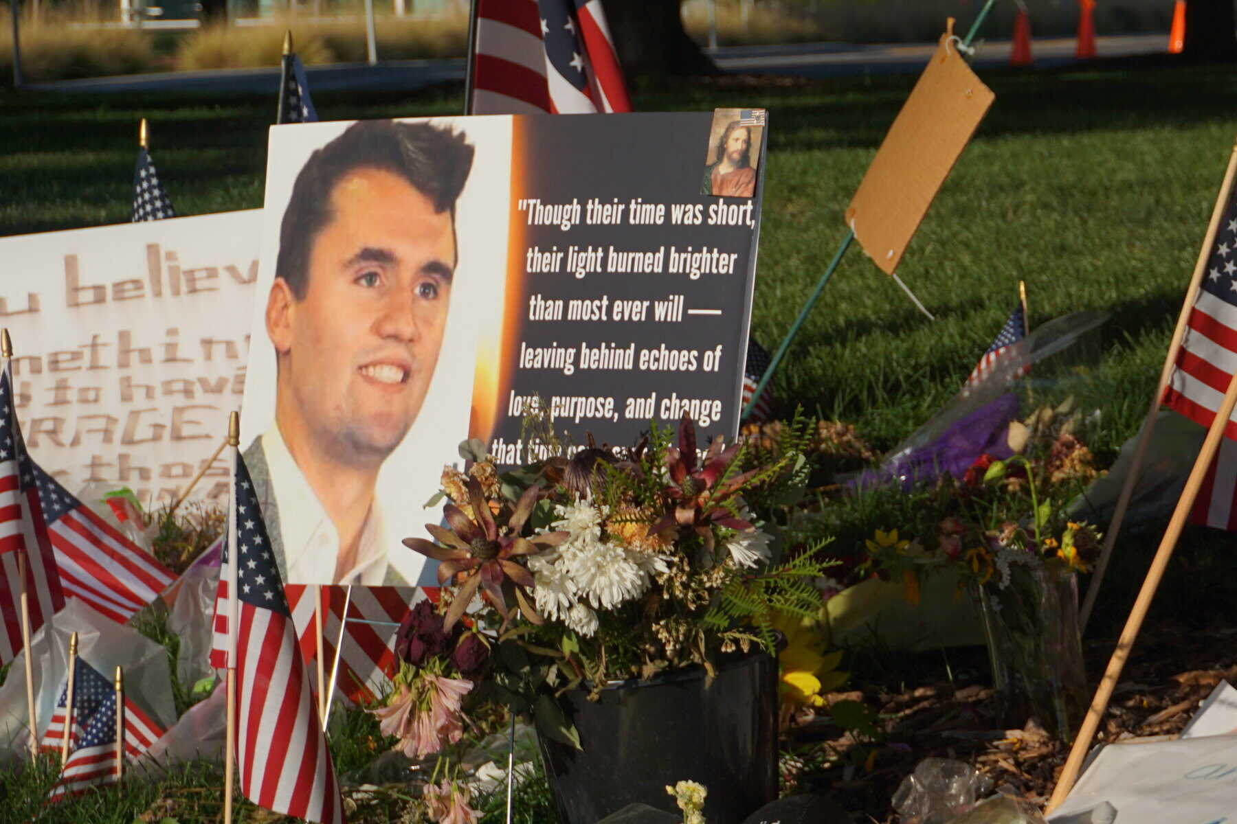 Signs, flags, and flowers placed by Orem residents on UVU Campus in memory of Charlie Kirk after the September 10th shooting | Photo by: Matthew Franke