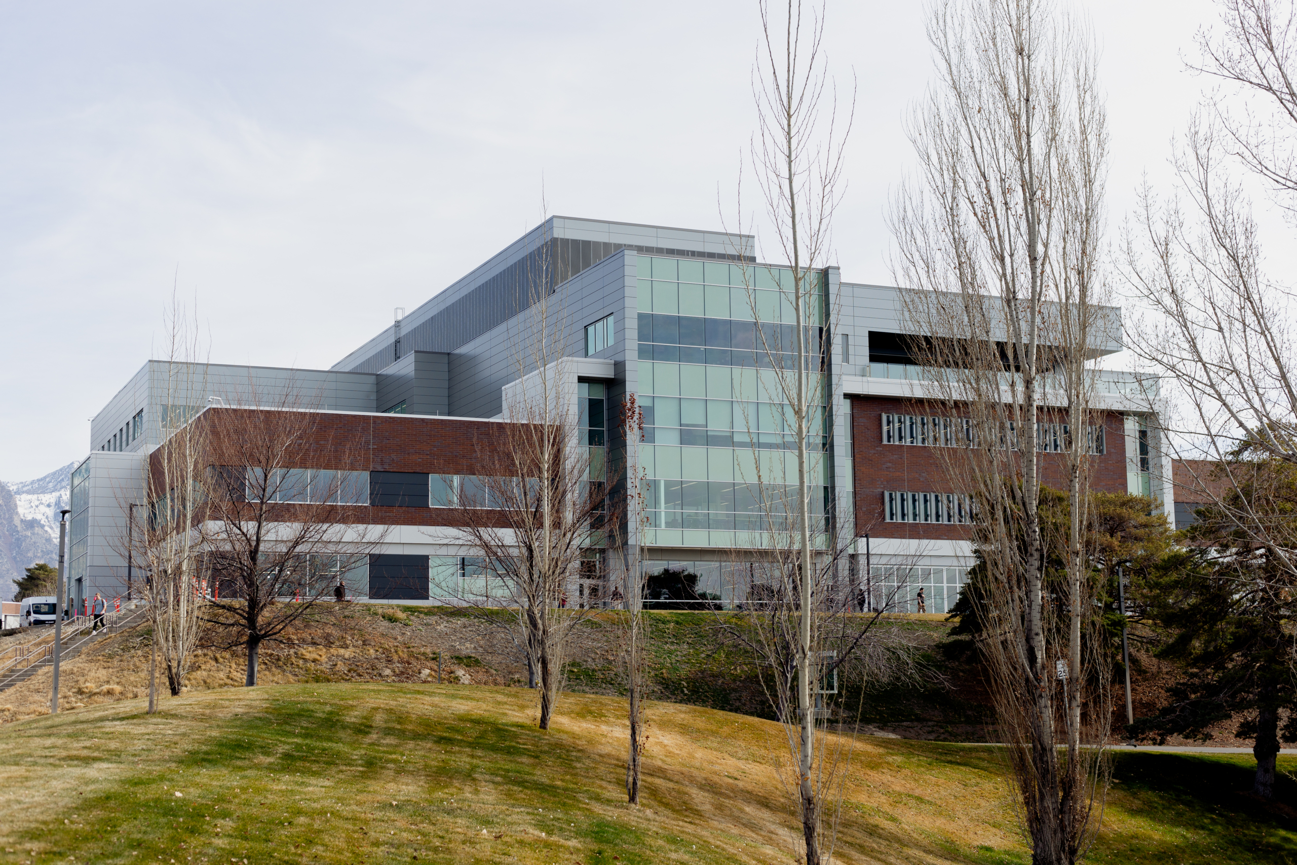 Glass and brick building on top of a hill